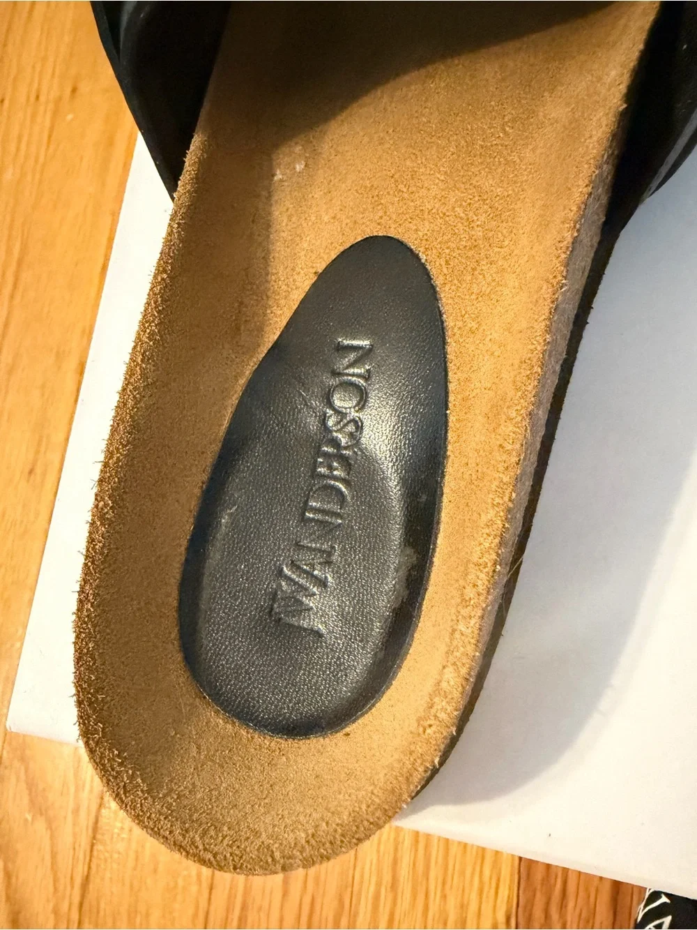 JW Anderson Women’s Black Slide Sandals with Gold Chain Accent